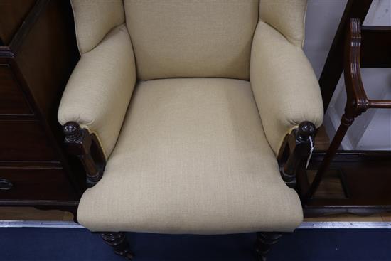 A Victorian rosewood upholstered wing armchair